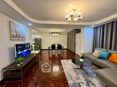 Spacious modern living room with elegant decor and open dining area.