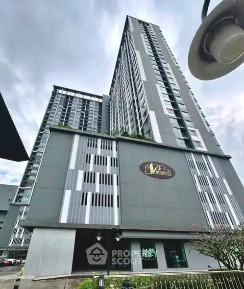 Modern high-rise residential building with sleek design and urban appeal.