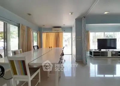 Spacious living room with large windows and modern decor