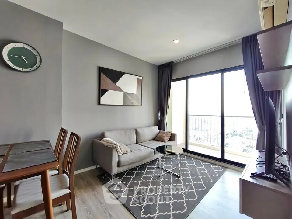 Modern living room with stylish decor and large window offering a stunning view.