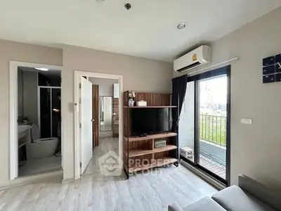Modern living room with balcony access and sleek interior design.