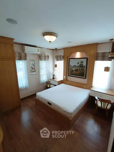 Cozy bedroom with wooden furniture and natural light