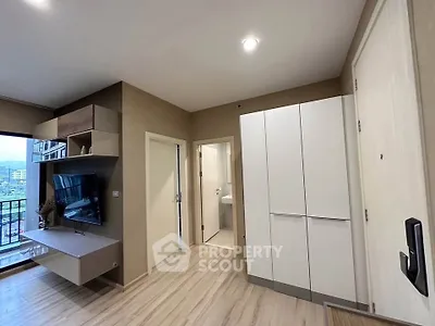 Modern living room with balcony view and sleek storage solutions