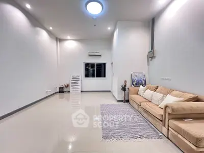 Spacious modern living room with elegant sofa and stylish decor