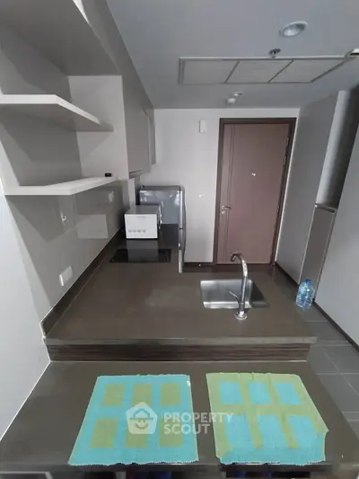 Modern kitchen with sleek countertops and stainless steel appliances, perfect for urban living.