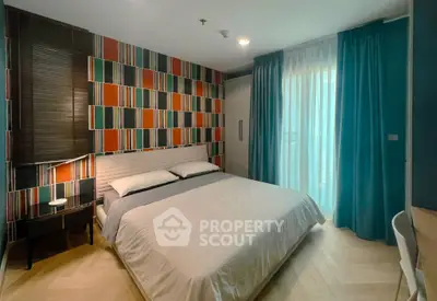 Stylish bedroom with colorful accent wall and cozy lighting in modern apartment