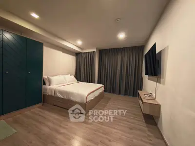 Spacious modern bedroom with sleek design and cozy ambiance