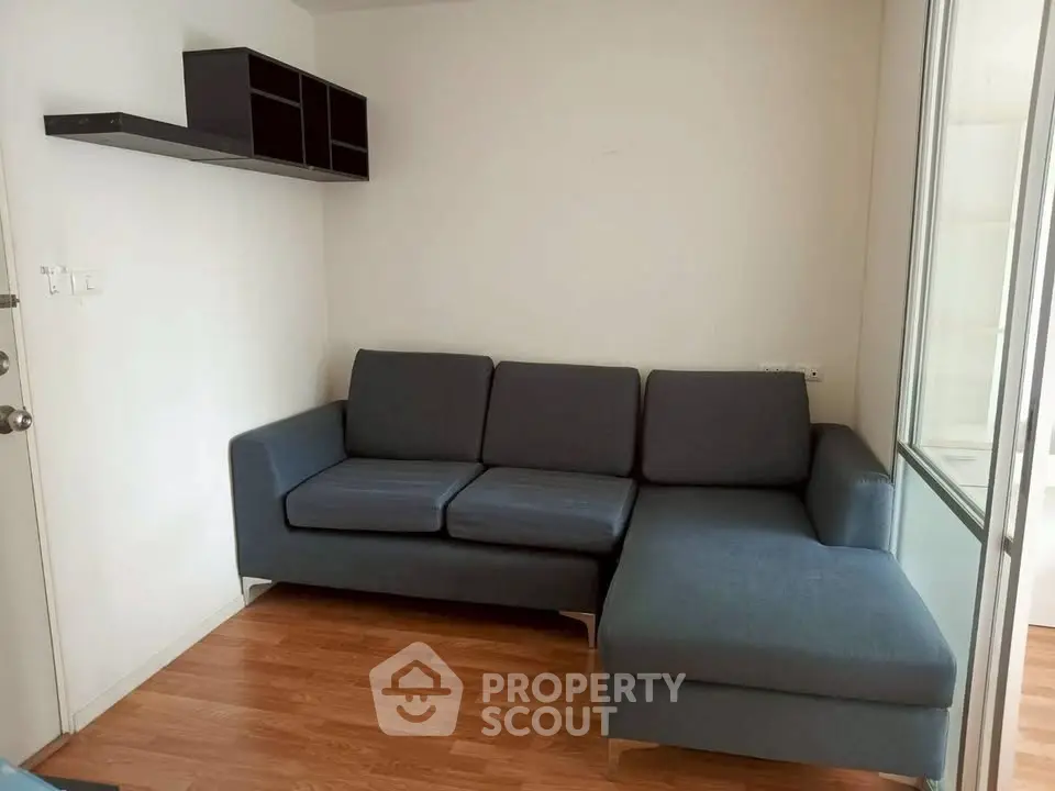 Cozy living room with modern L-shaped sofa and wooden flooring