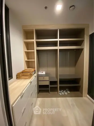 Spacious walk-in closet with ample shelving and storage space in modern home.