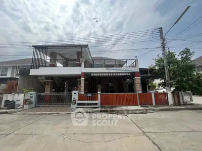 Charming two-story house with spacious balcony and modern design in a serene neighborhood.