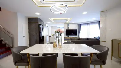 Luxurious modern living room with elegant dining area and stylish decor