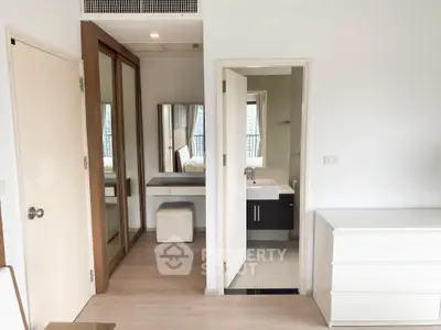 Modern bedroom with ensuite bathroom and stylish furniture