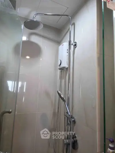Modern bathroom with sleek shower fixtures and glass enclosure