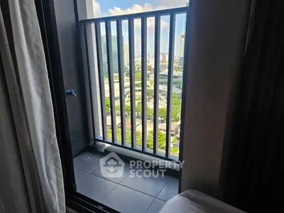 Charming city view from a cozy balcony, perfect for relaxation and enjoying urban scenery.