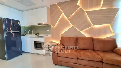 Modern living room with stylish kitchen and unique wall design