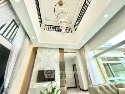 Luxurious modern living room with high ceiling and elegant lighting
