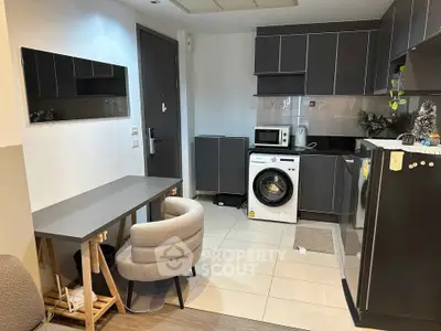 Modern compact kitchen with washing machine and sleek cabinetry