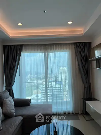 Modern living room with city view and elegant curtains