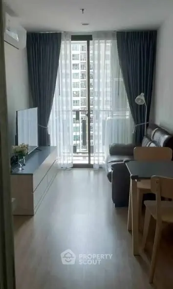 Cozy living room with modern furniture and large window view