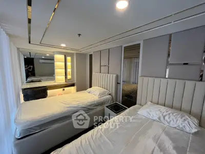 Luxurious modern bedroom with twin beds and elegant decor