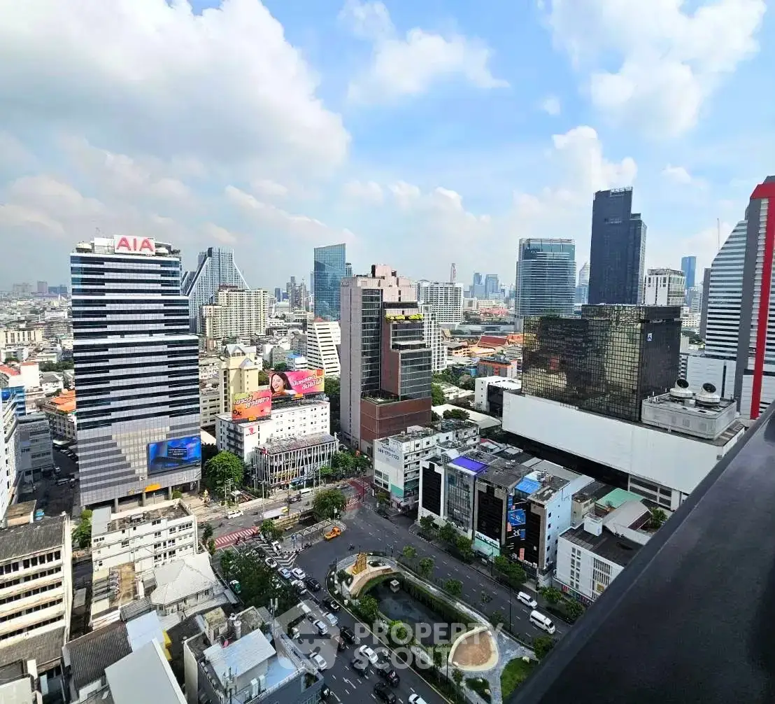 Stunning cityscape view from high-rise building balcony in vibrant urban area.