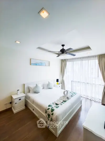 Bright and airy bedroom with modern decor and large windows