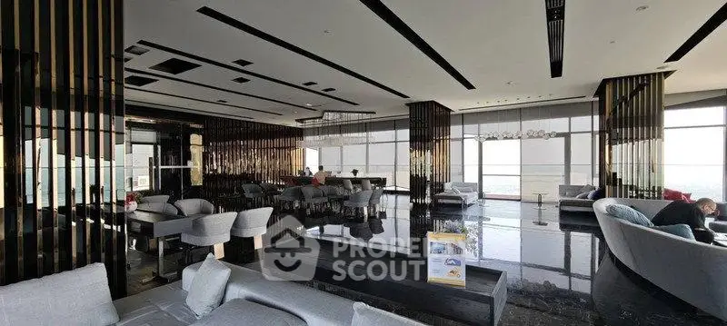 Luxurious modern lounge with panoramic city views and elegant seating areas.