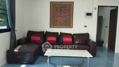 Cozy living room with leather sofa and modern decor