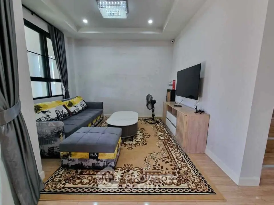 Modern living room with stylish decor and large window