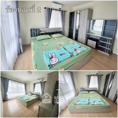 Spacious bedroom with modern furniture and large windows for natural light.