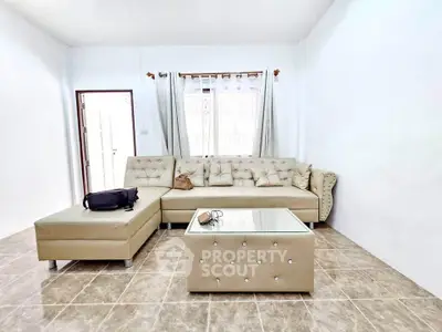 Spacious living room with elegant beige sofa and modern decor