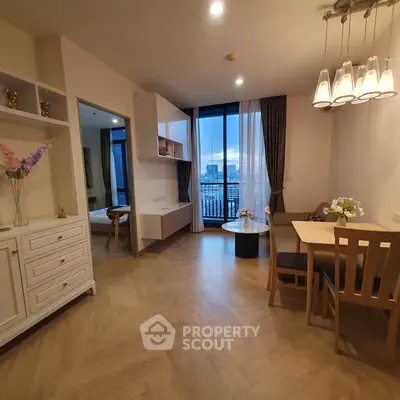 Modern living room with dining area and city view balcony in elegant apartment.