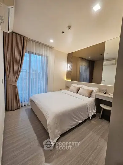 Modern bedroom with cozy decor and city view from window