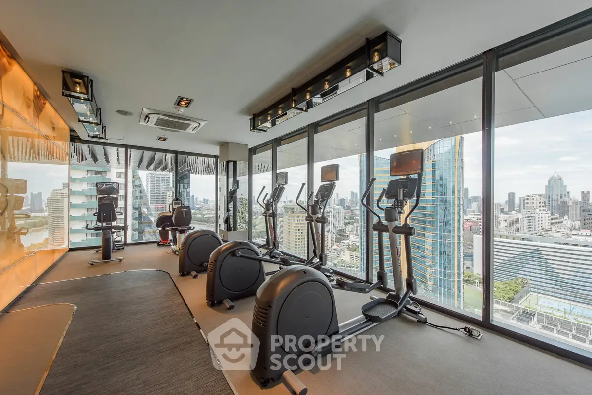 Modern gym with panoramic city views in luxury high-rise building