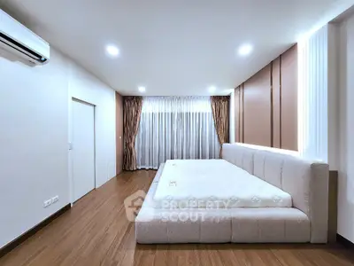 Spacious modern bedroom with elegant design and large bed