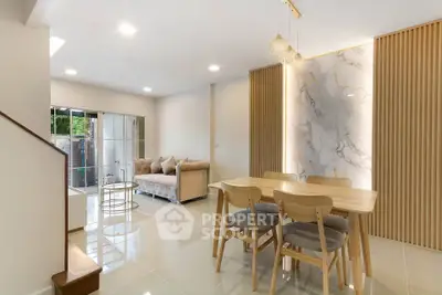 Modern living room with elegant dining area and stylish decor