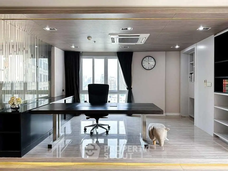 Modern study room with sleek desk and city view, perfect for productivity.