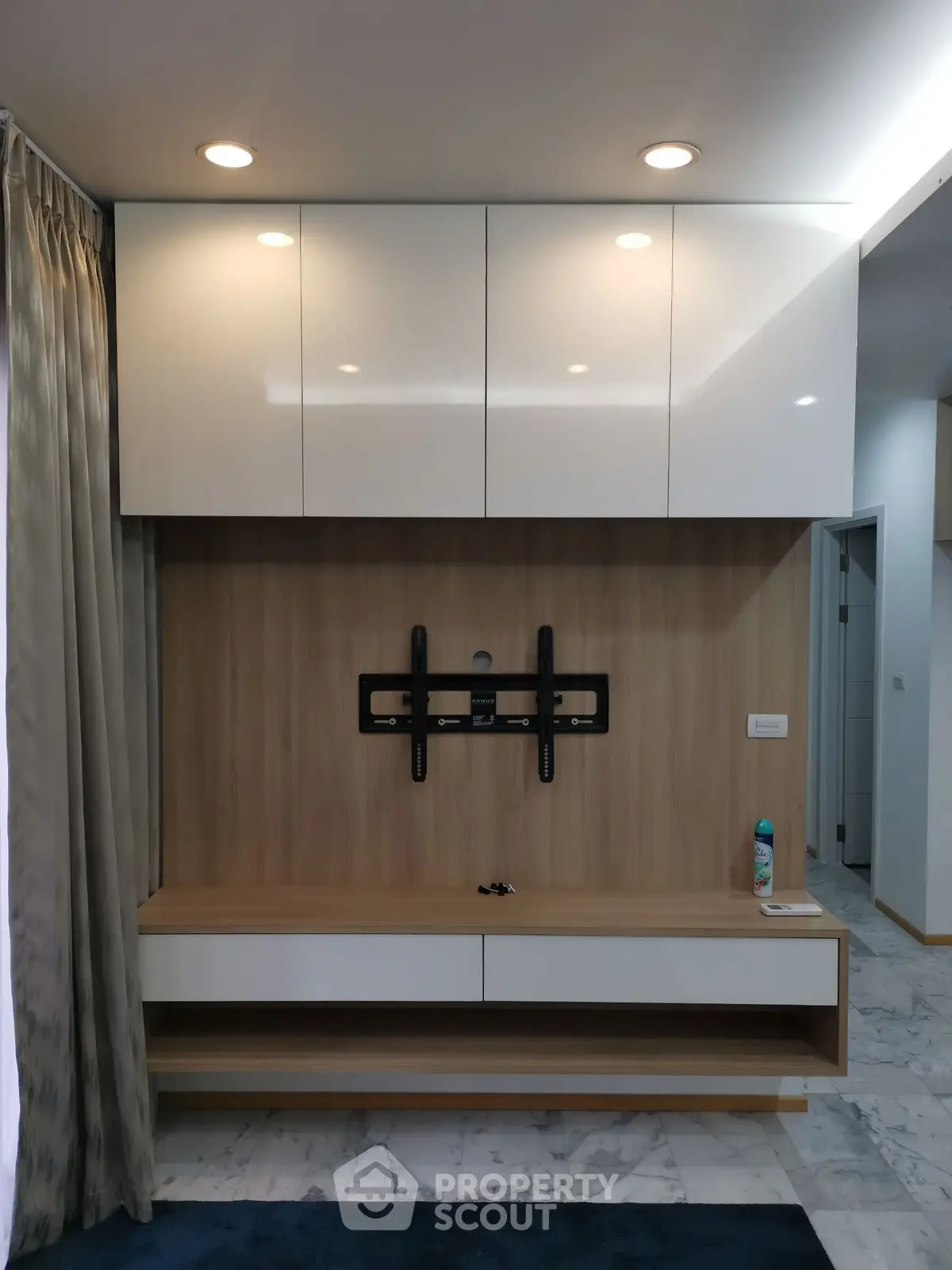 Modern living room with sleek built-in TV cabinet and elegant lighting