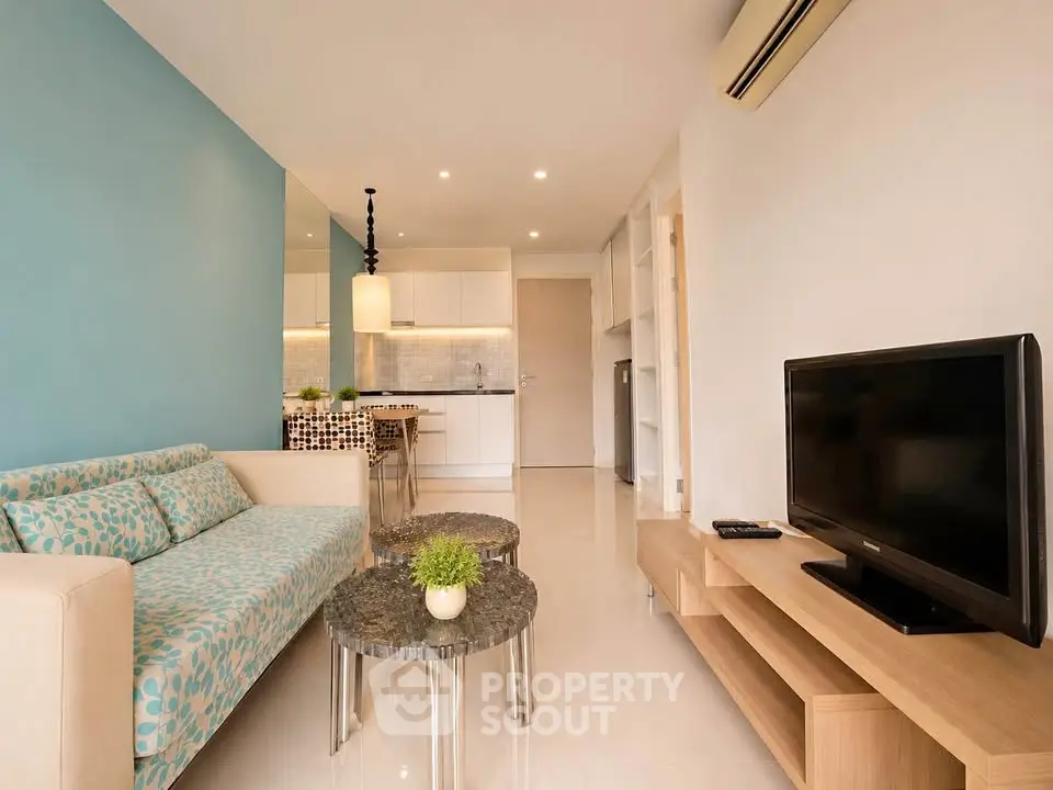 Modern living room with stylish decor and open kitchen layout