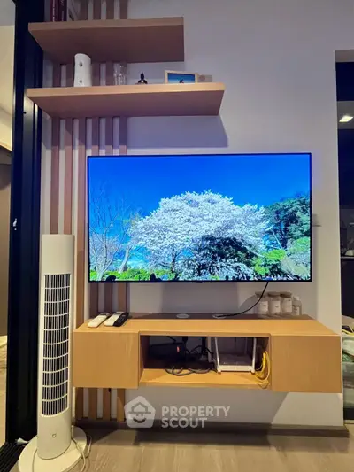 Modern living room with wall-mounted TV and sleek shelving unit
