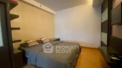 Modern bedroom with sleek design and cozy atmosphere, featuring a comfortable bed and stylish decor.