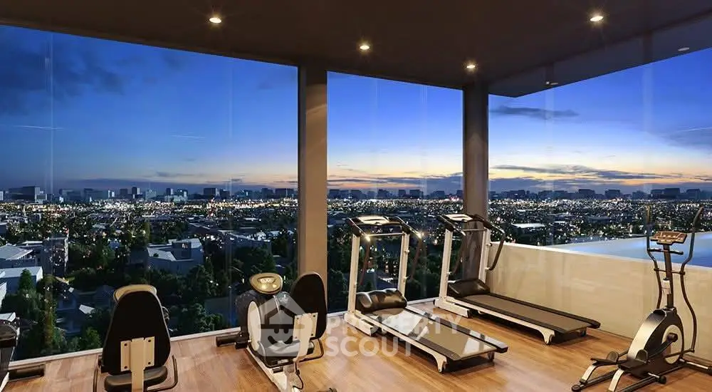 Luxurious gym with panoramic city views and modern fitness equipment.