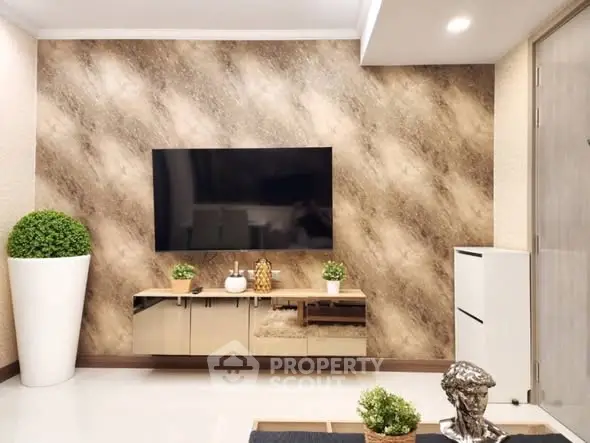 Modern living room with stylish decor and wall-mounted TV