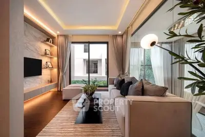 Luxurious modern living room with elegant decor and large windows for natural light.