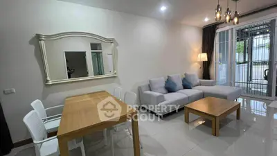 Modern living room with stylish furniture and elegant lighting in a cozy apartment.