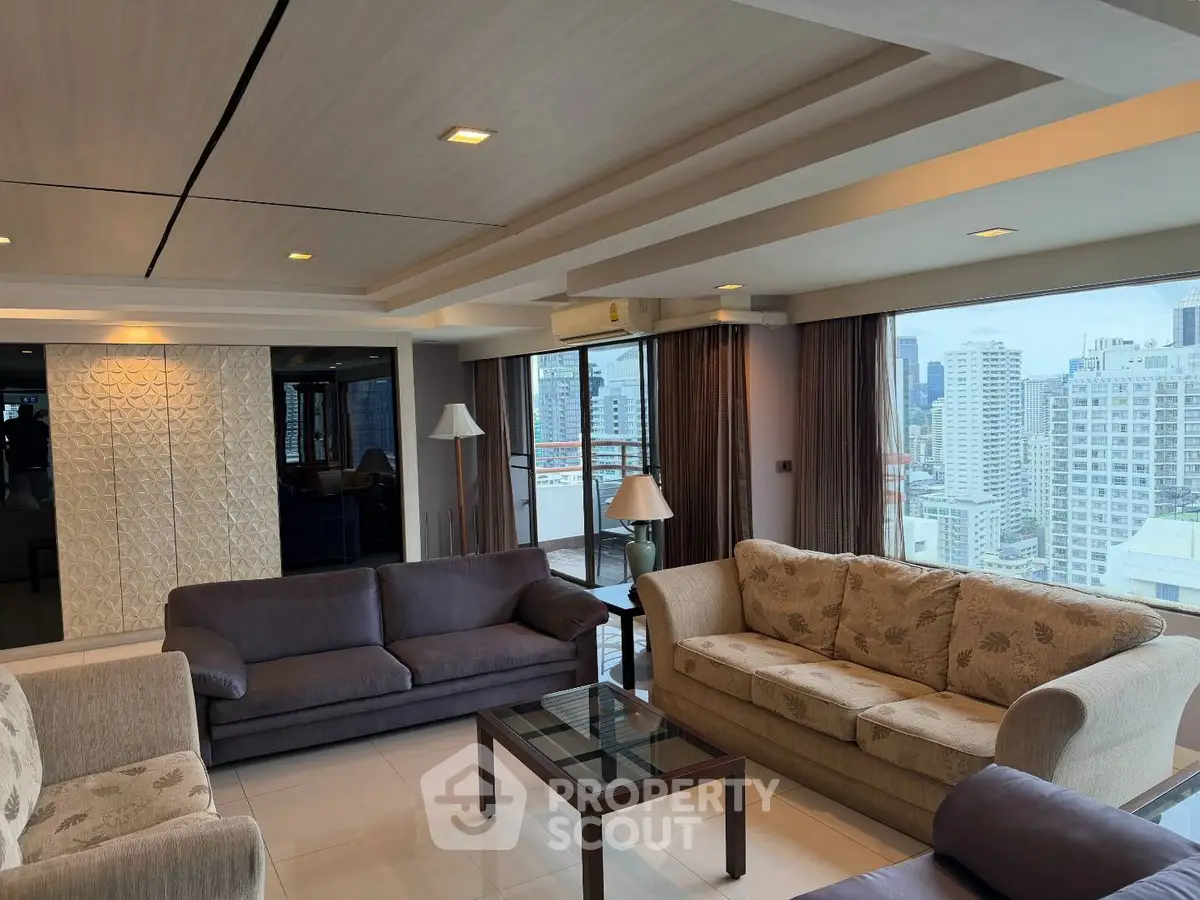 Spacious living room with panoramic city views and elegant furnishings