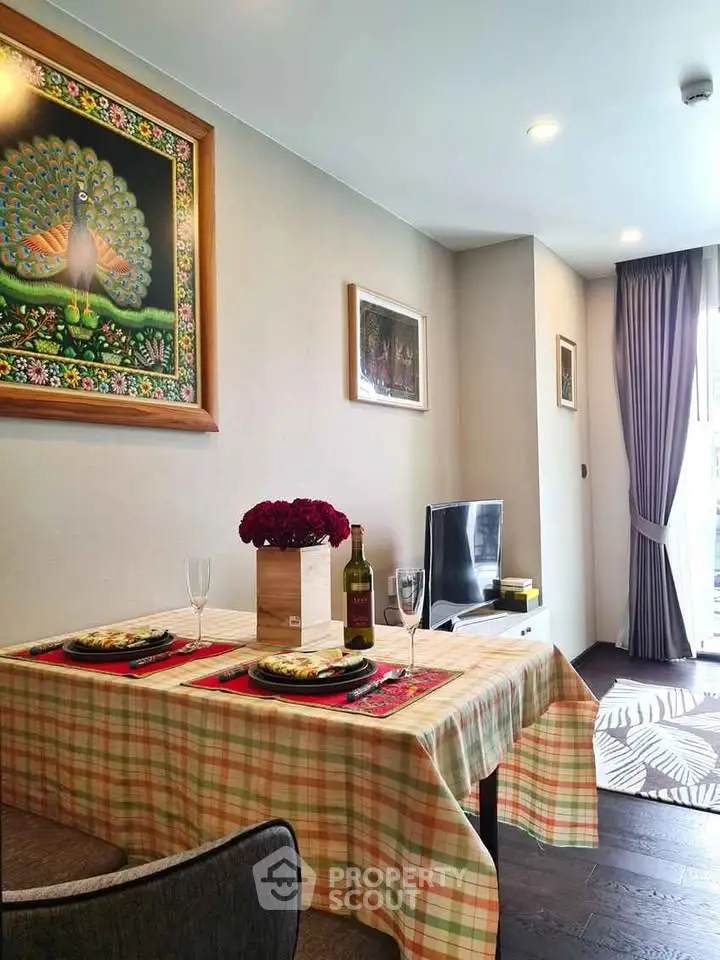 Charming dining area with elegant table setting and cozy living room ambiance.