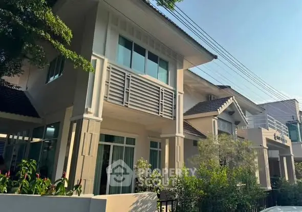 Charming suburban house with modern architecture and lush greenery, perfect for family living.