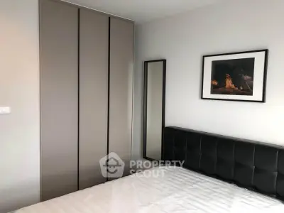 Modern bedroom with sleek wardrobe and stylish decor