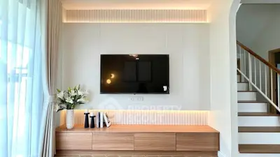 Modern living room with sleek TV setup and elegant decor